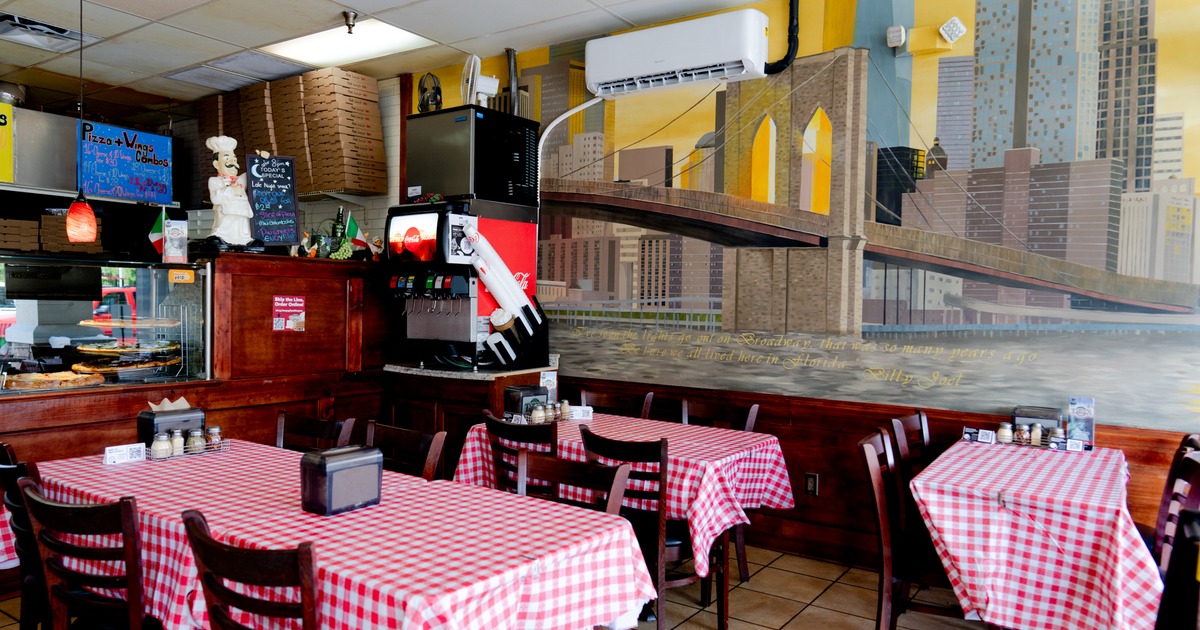 Interior, diner area, tables and chairs, food counter behind