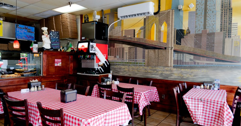 Interior, diner area, tables and chairs, food counter behind