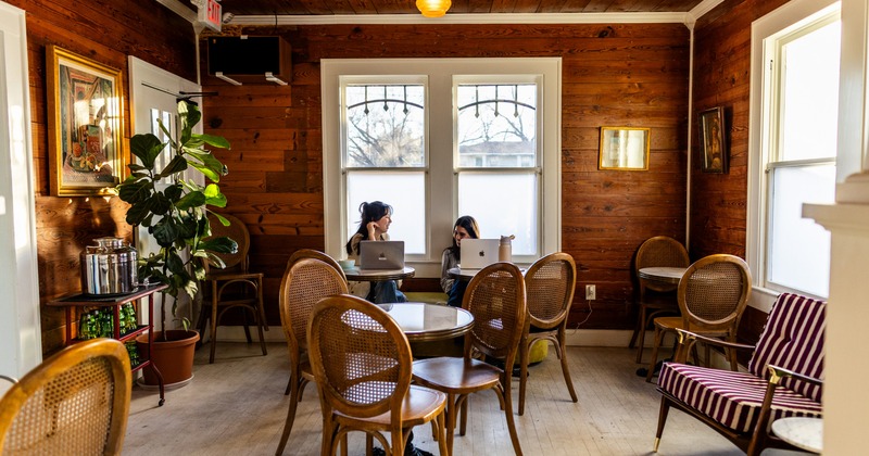 Interior, wooden chairs and tables, wooden walls