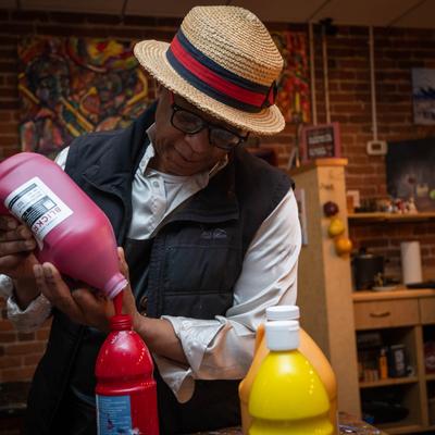 Pouring bottles of paint.