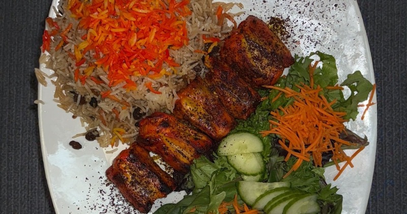 Spiced chicken kabob served with saffron rice and salad
