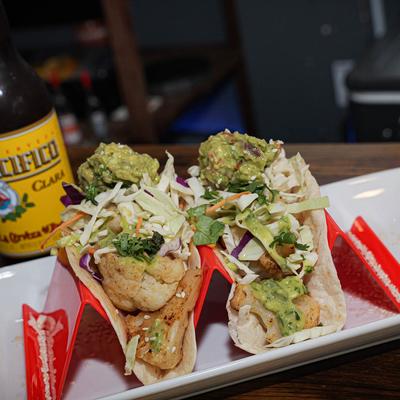 Roasted Cauliflower Tacos with a bottle of beer.