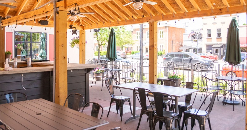 Covered patio area, bar, tables and seating