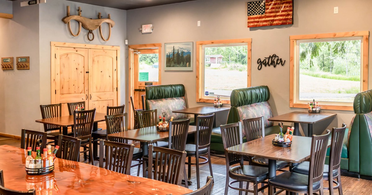 Interior, seating area with booths in the back