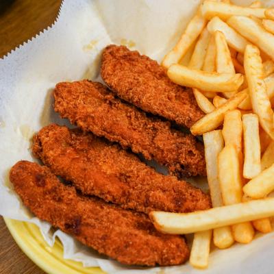 crispy chicken tenders meal with side of french fries.