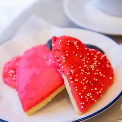Heart shaped cookies with red frosting.
