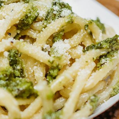 Spaghetti with parmesan and pesto.