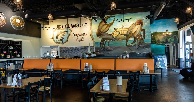 Interior, long banquette seating bench and painted wall behind