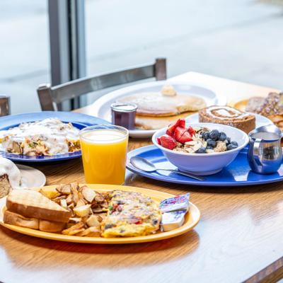 French Toast, Orange Juice, Oatmeal Bowl with Berries, Pancakes, Kitchen Sink Bowl, Pumpkin Roll.
