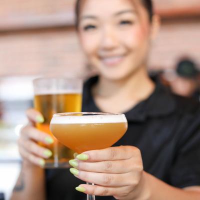 A bartender with drinks.