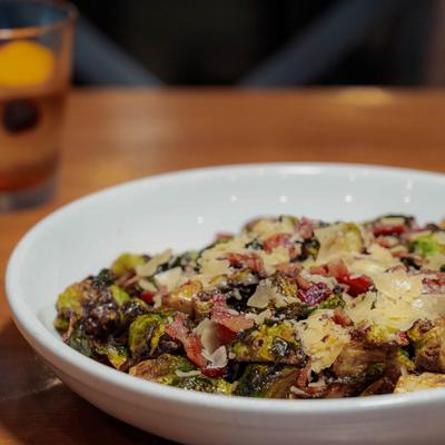 Crispy fried brussels sprouts, with bacon, parmesan, pomegranate, and sweet chili.