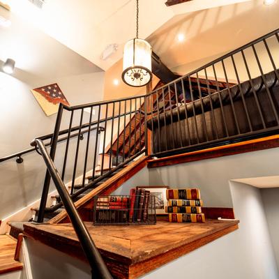 Staircase, books on the table.