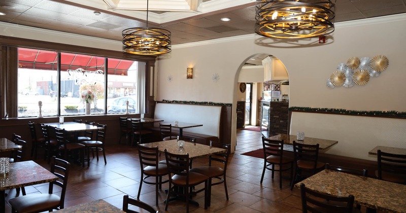 Interior, tables with chairs are waiting for the guests