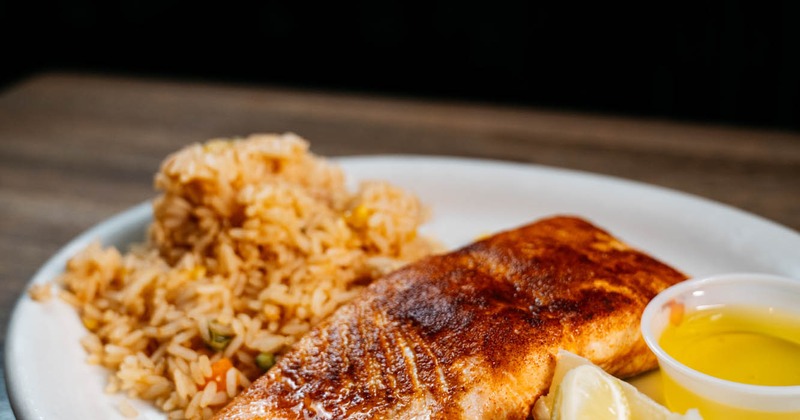 Blackened salmon fillet, with rice, and melted butter