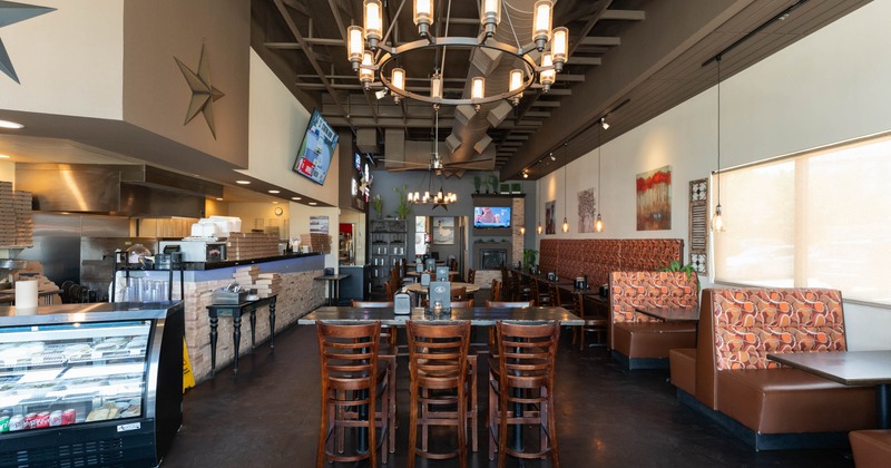 Interior, open space seating area, high and regular tables, booths and banquette seating