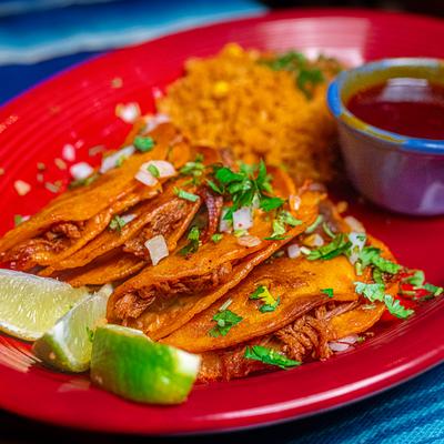 Quesabirria tacos  with birria consomme and ice.
