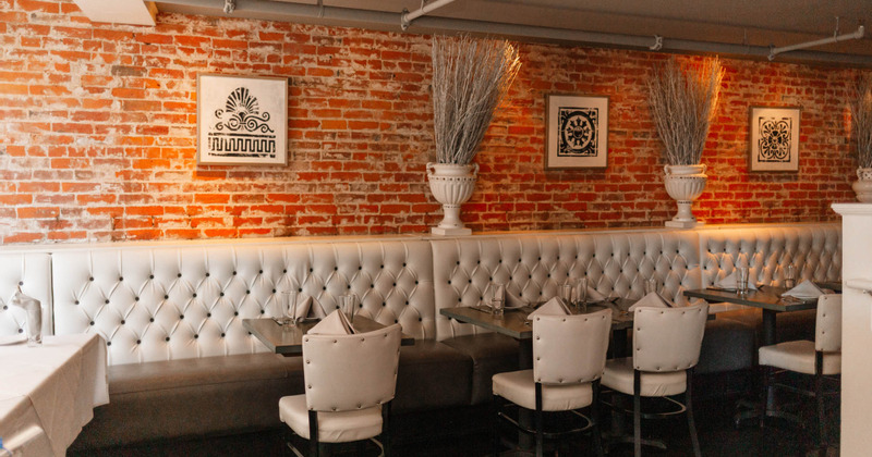 Downstairs interior, wall- mounted leather benches, tables and chairs