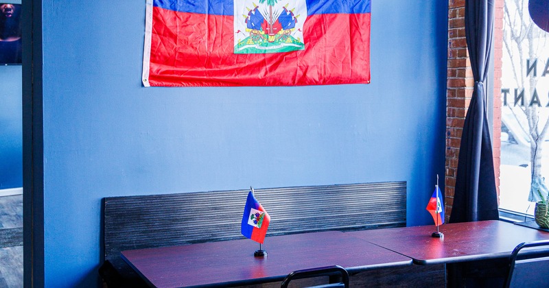 Diner table, flag on the wall