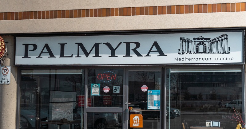 Exterior, front view to restaurant, sign above entrance