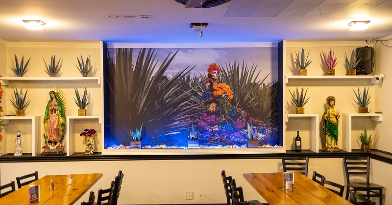 Interior, dining area, picture on the wall shows the true beauty of Mexican culture