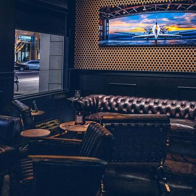 Interior, Leather lounge seating area with sofas and armchairs.