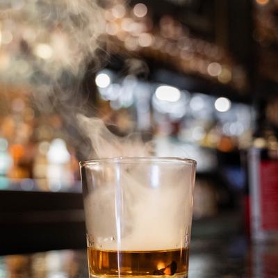 smoke leaving whiskey glass.