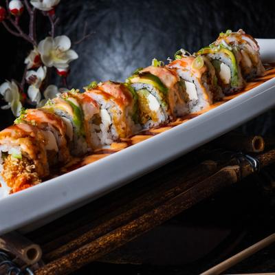 Spicy shrimp and salmon rolls, with eel sauce, and avocado.