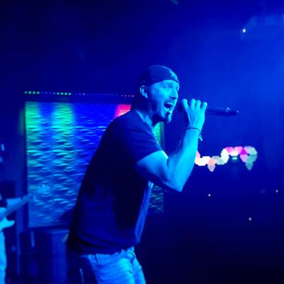 Singer performing on stage.