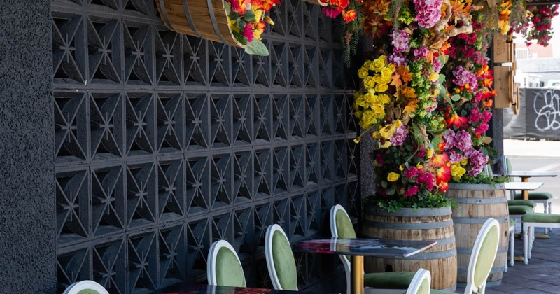 Exterior, floral decor at the entrance and a seating area