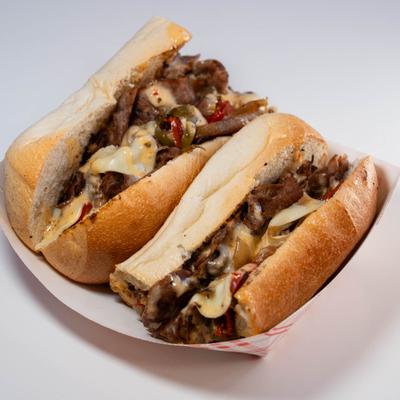Philly cheesesteak sandwich in a hoagie roll.