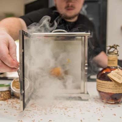 Smoked Old Fashioned in a container.