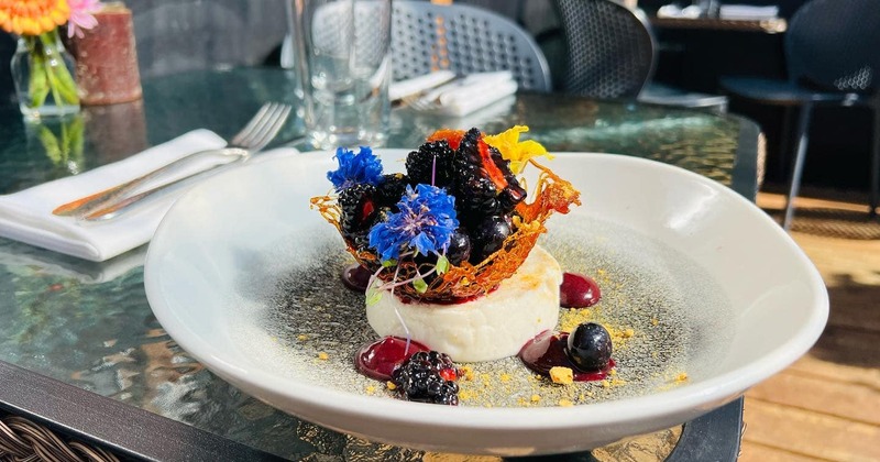 Vanilla bean creme brulee topped with berries