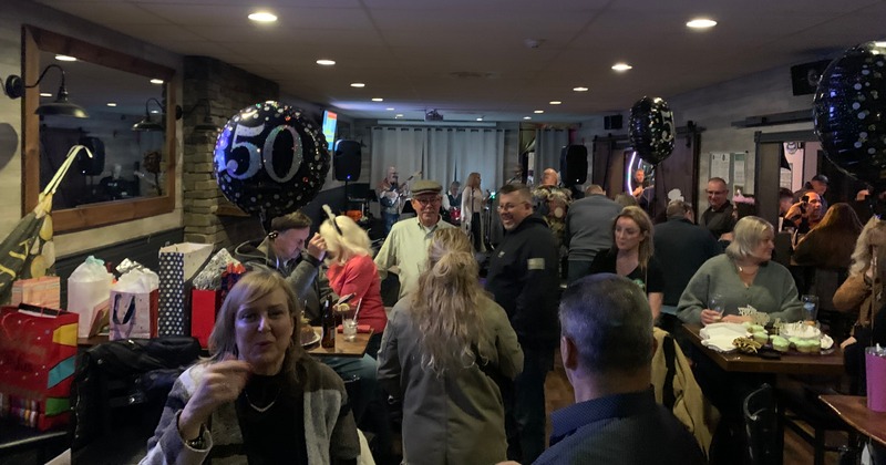 Guests socializing at a private party