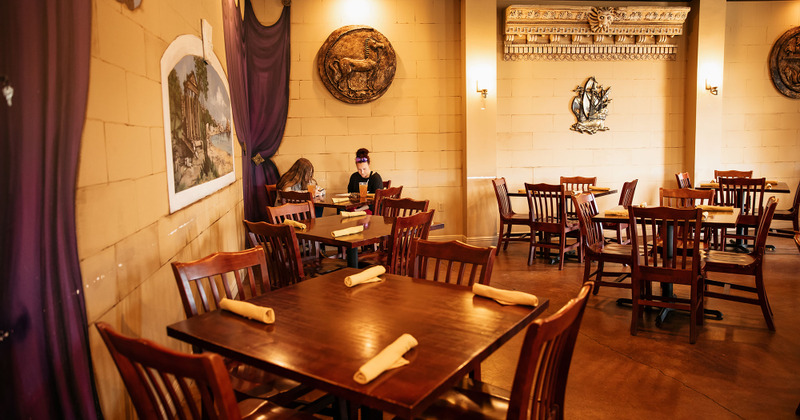 Interior, seating area with two guests enjoying drinks