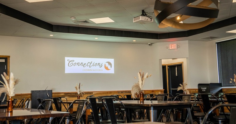 Interior, room with tables, chairs and projector on the ceiling