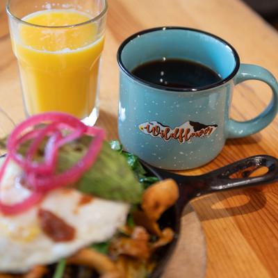 A meal, a coffee, and orange juice.