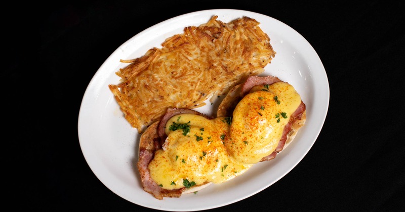Eggs Benedict with hashbrowns on the side