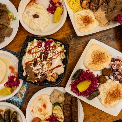 Mediterranean food variety platter with assorted dishes.