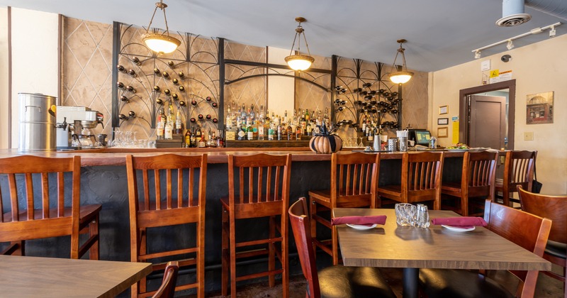 Interior, a bar and dining tables