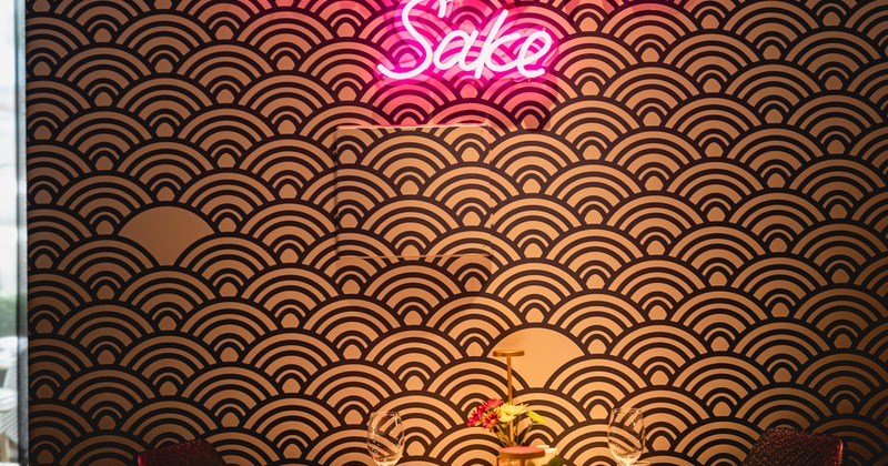 Diner table, light sign on the wall above