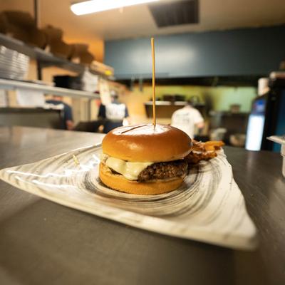 Burger with fries served on the kitchen counter