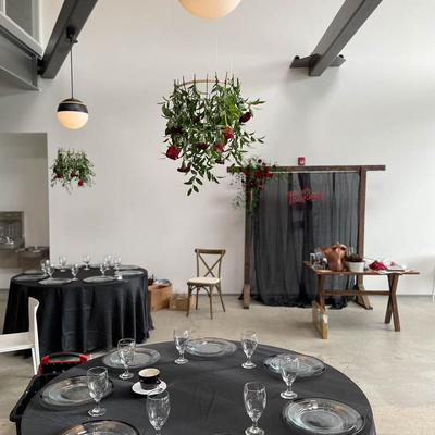 Interior,Tables with a black tablecloth and glasses and  glass plates arranged neatly.
