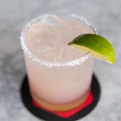 Pink drink with lime.