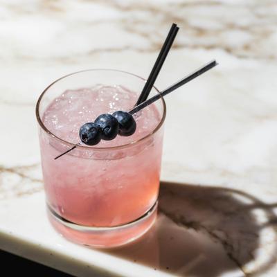 Rising Sun cocktail, with pineapple rum, unfiltered sake, pineapple juice, and Chambord.