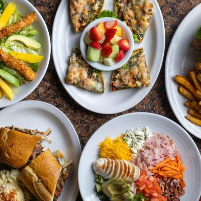 Variety of menu items served on the table, top view.