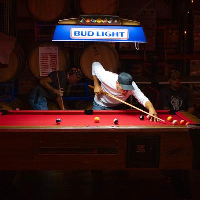 Customer playing pool.