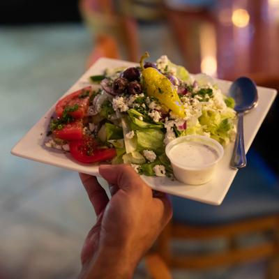 Hand held Greek salad plate