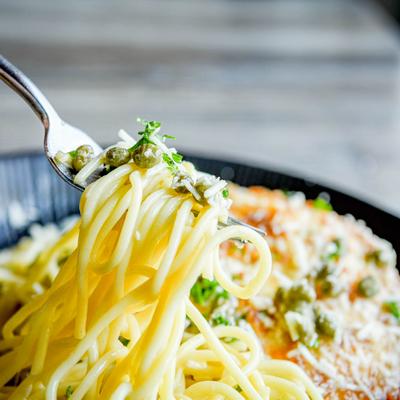 Pan seared tender chicken breast, lemon butter sauce, and capers, served over pasta.