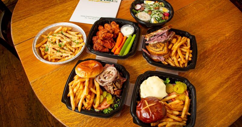 Various dishes in take out containers on the table