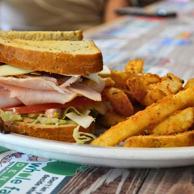 Deli sandwiches and fries.